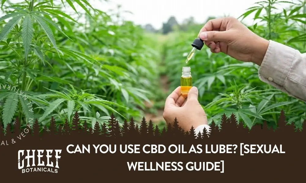 A man using a CBD oil dropper in a field of CBD plants.