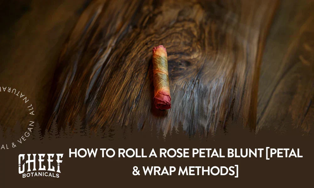 A rose petal blunt sitting on a wooden table.