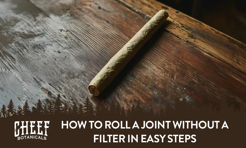 How to roll a joint without a filter featured blog image by Cheef Botanicals. Shows a hand rolled joint on a wooden surface