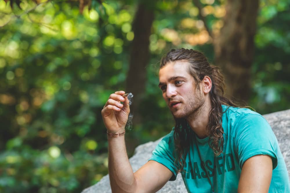 matias smoking a pre-roll cbd