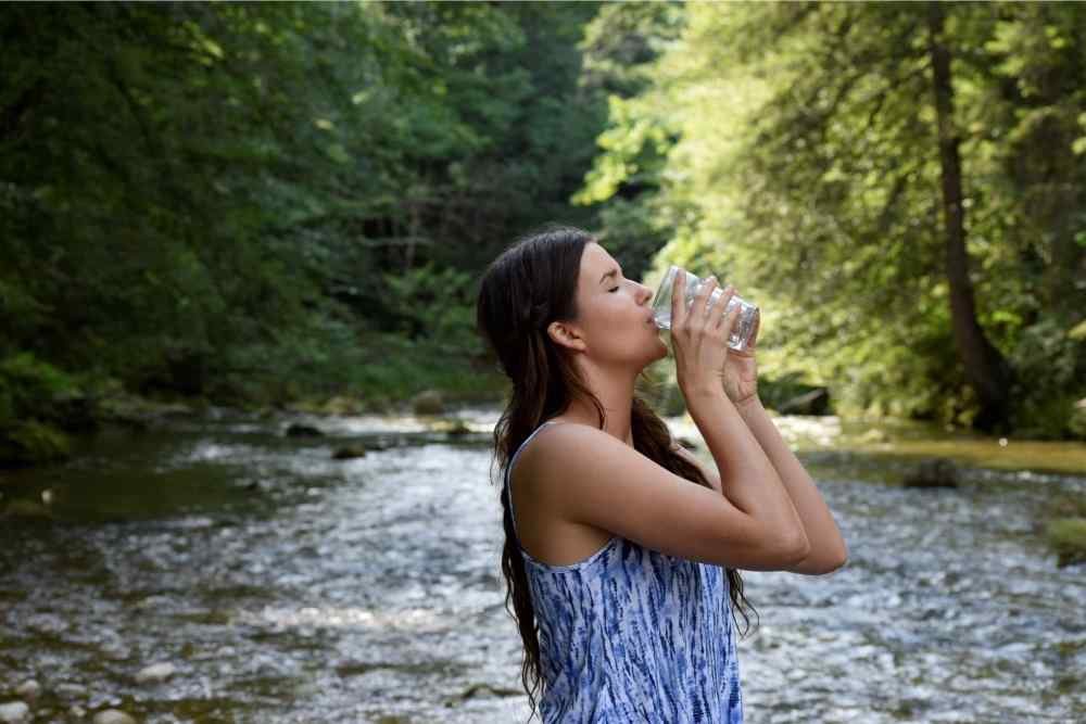 a glass of water next to water