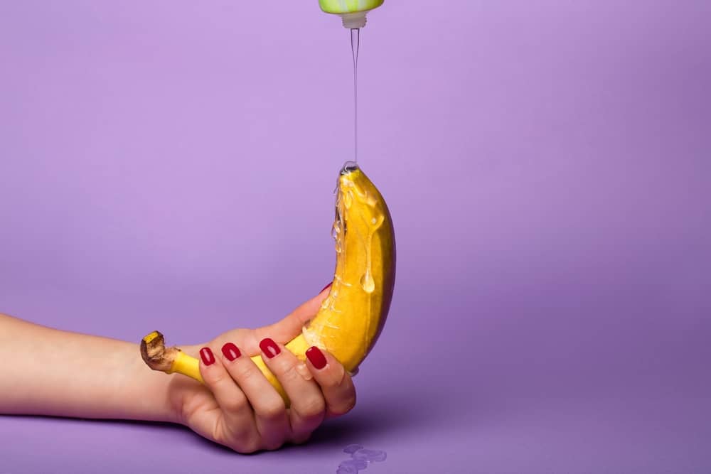 putting lube on a a banana