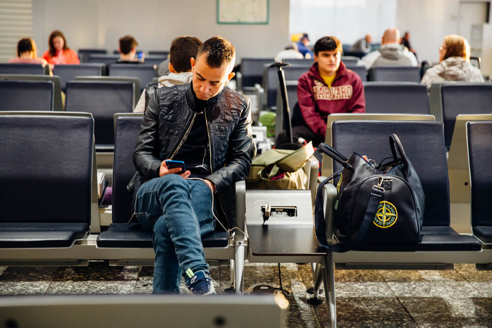 man waiting in airport packing cbd