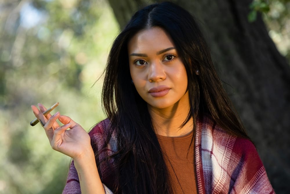 woman holding a joint