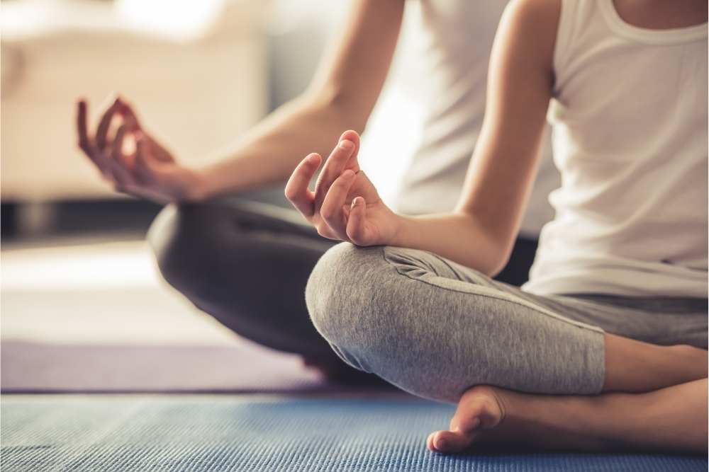 two people meditating