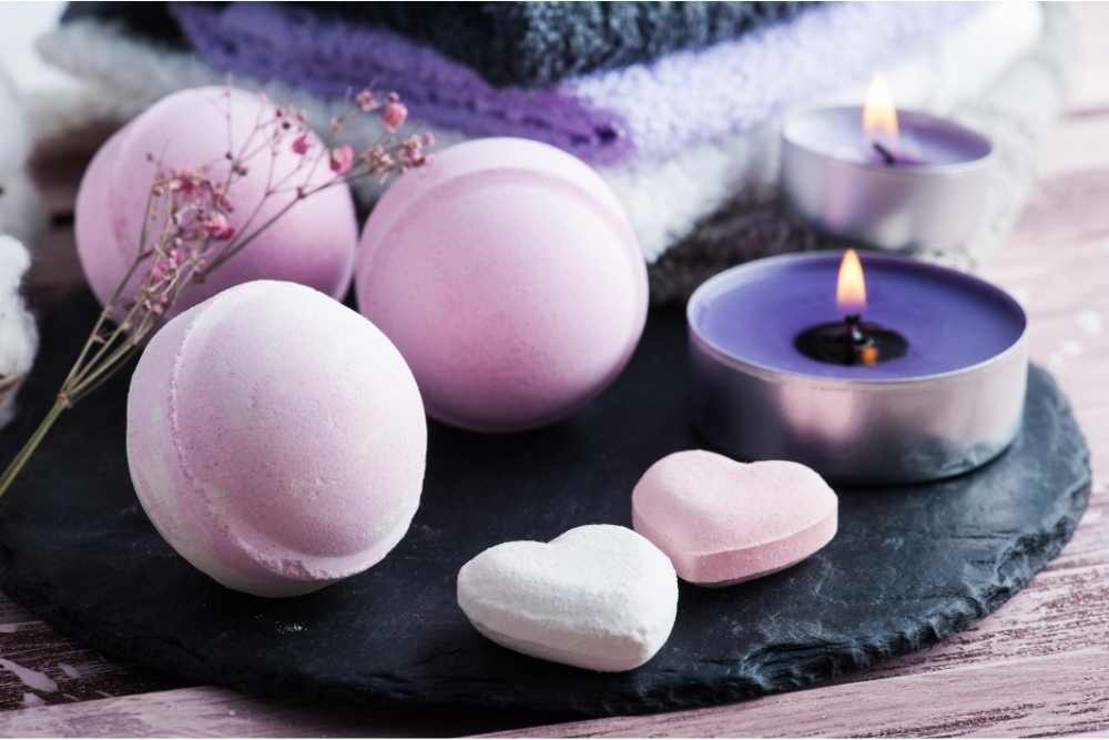 bath bombs on a plate with candle