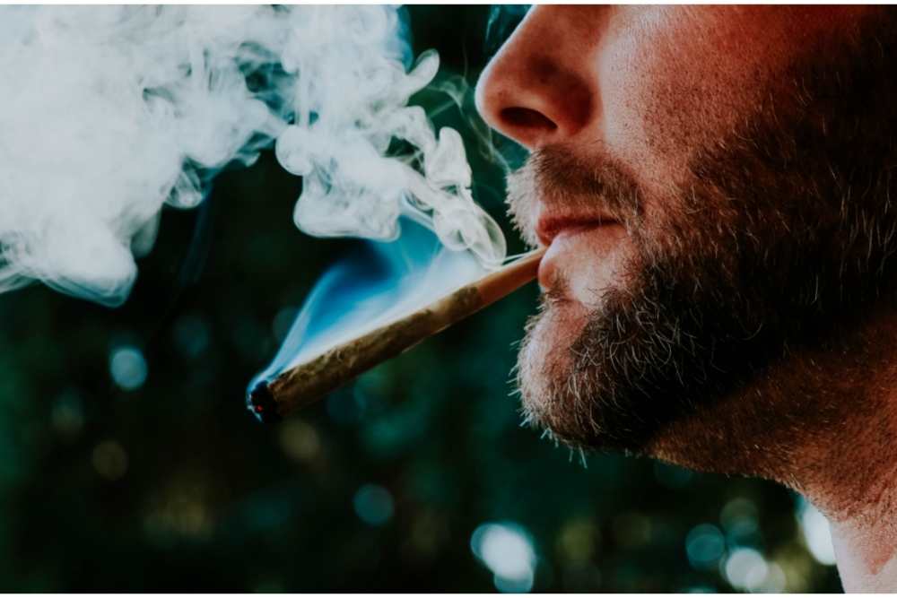 man smoking a joint
