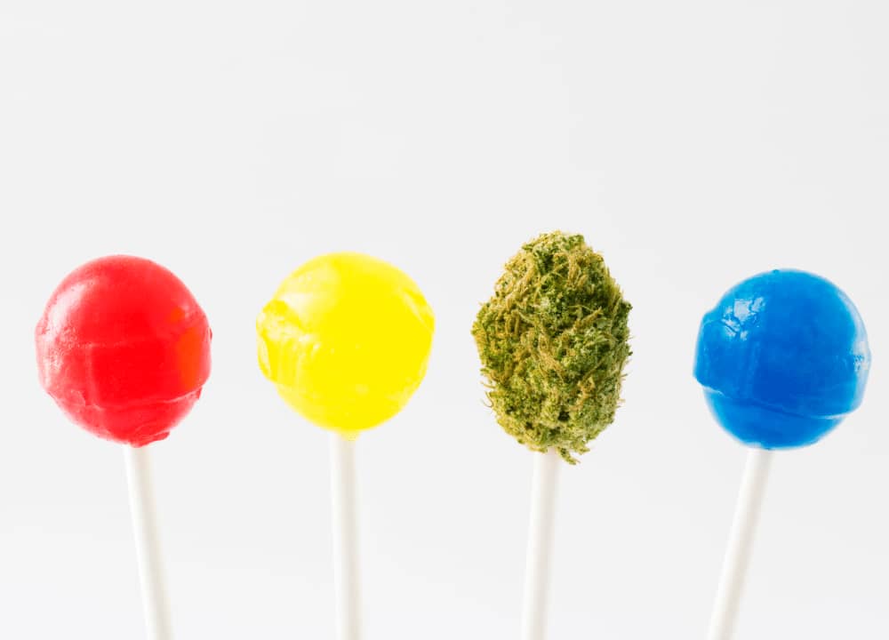 colored lollipops and hemp bud