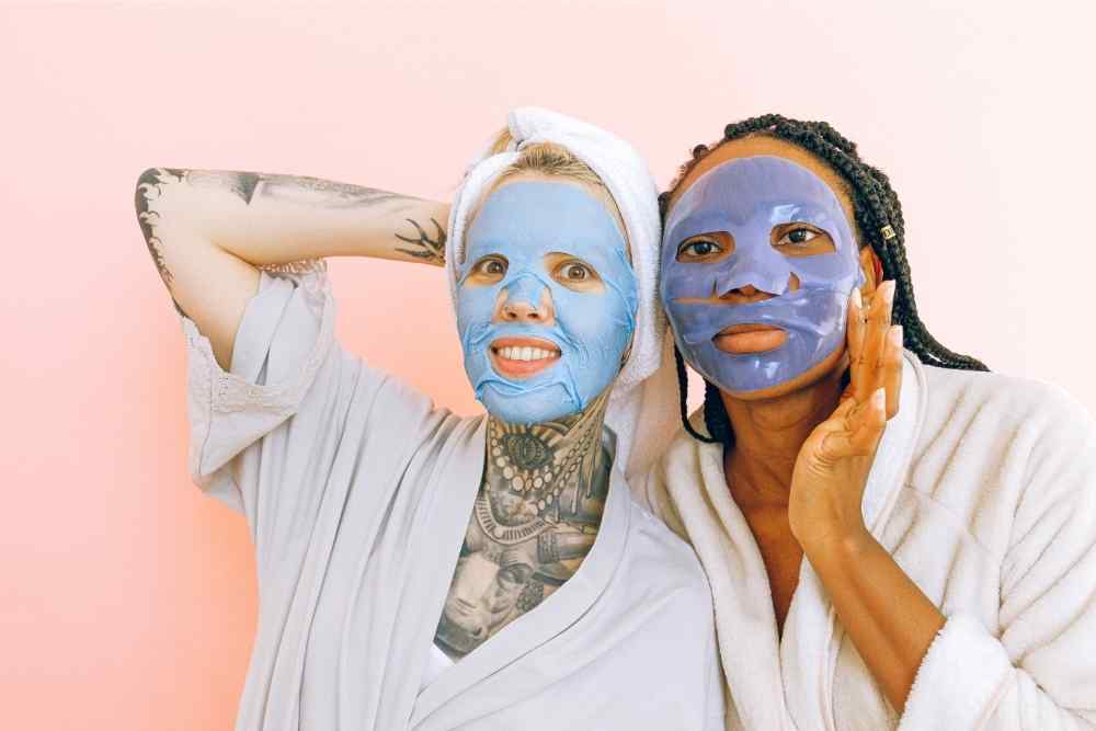 two women with blue masks