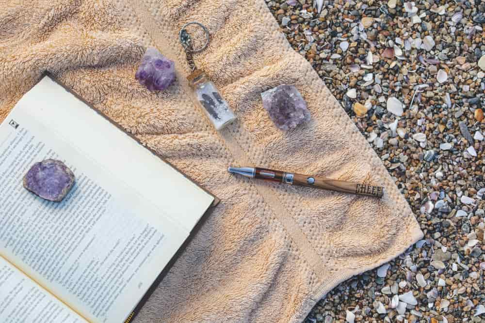 vape pen with crystals on towel