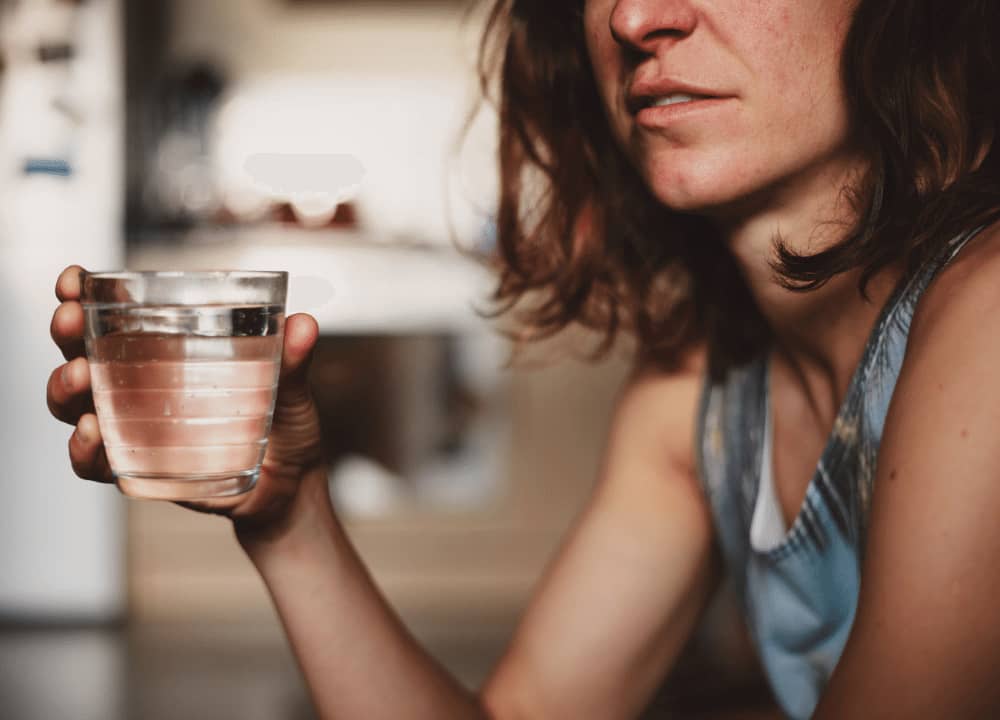 woman drinking water for sleep