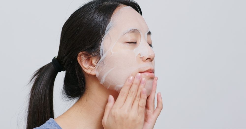 woman using a peel off mask