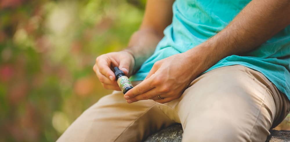 man holding cheef oil