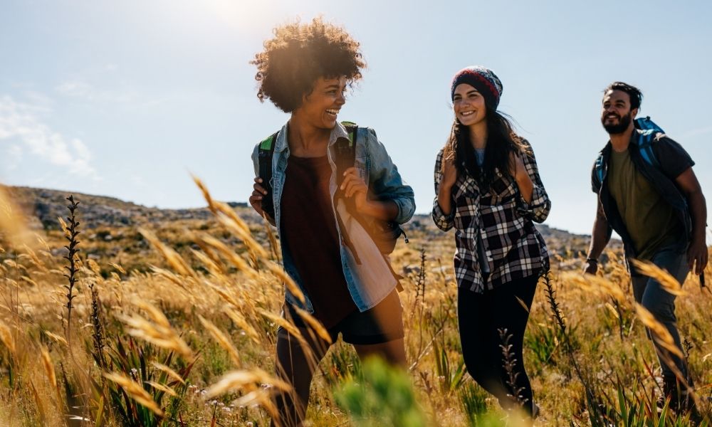 happy people going for a hike