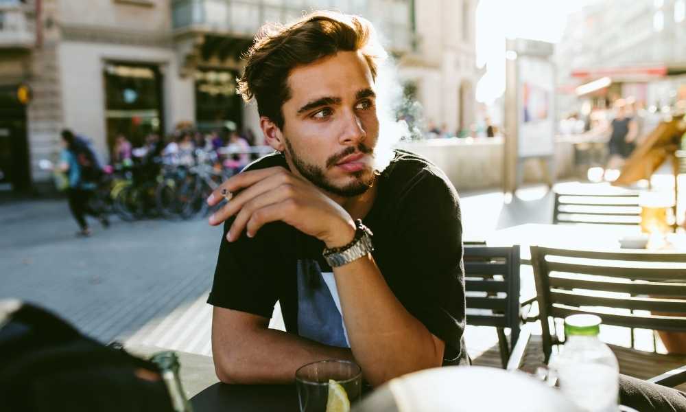 guy smoking at cafe