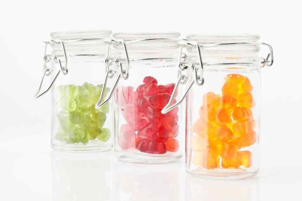 three jars of colorful cbd gummies