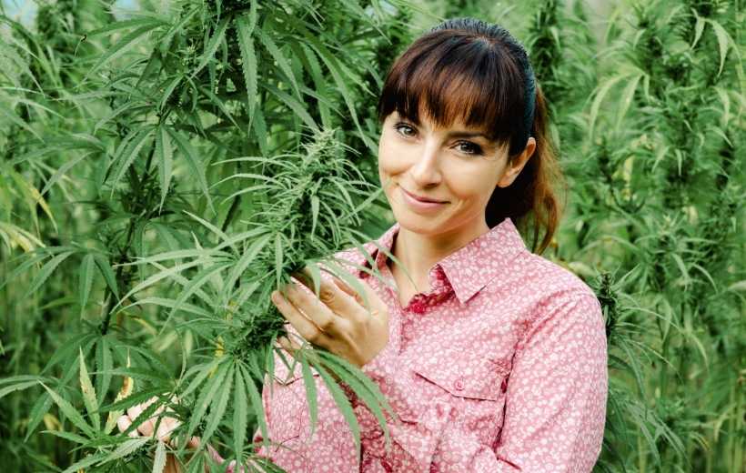 happy woman holding hemp