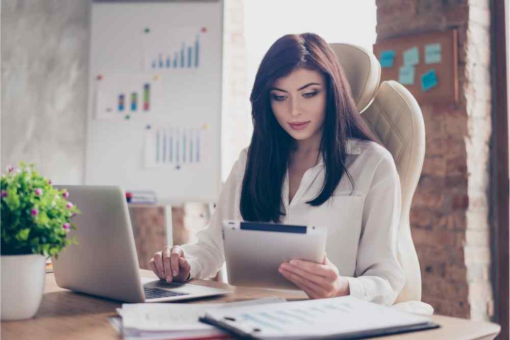 woman holding tablet