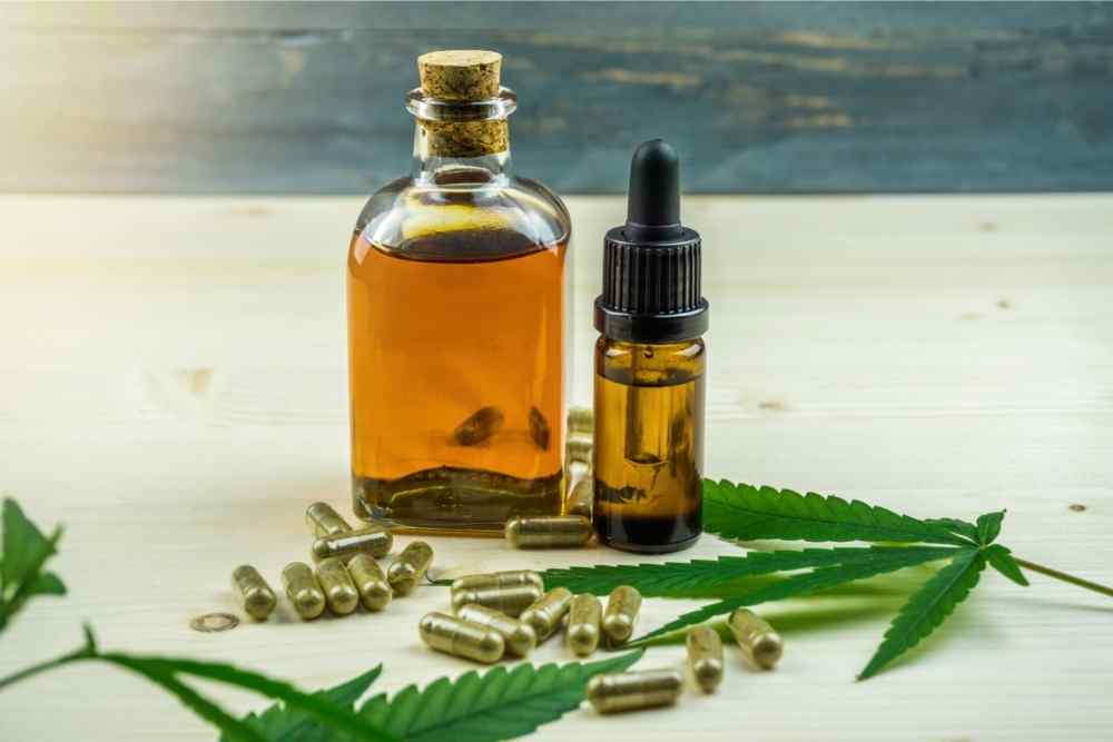 cbd capsules spread on table