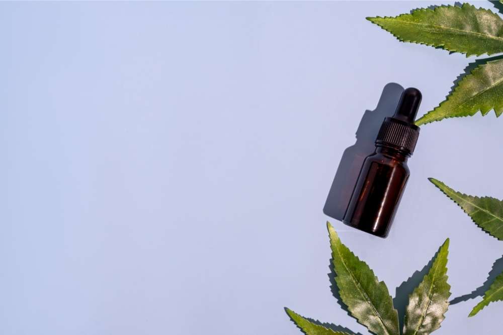 cbd-oil-in-purple-background