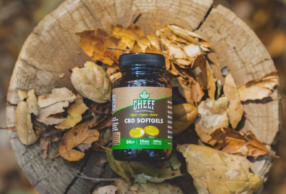 softgels jar in outdoors with leaves