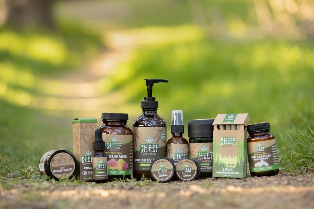 cbd products lined up on grass