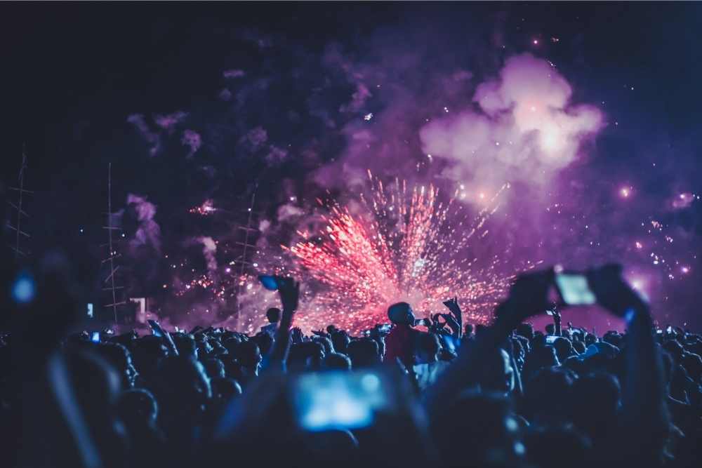 crowd enjoying concert with fireworks