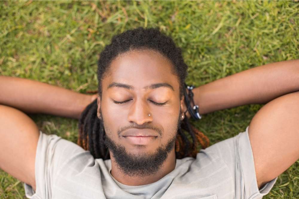 cool dude relaxing on the grass