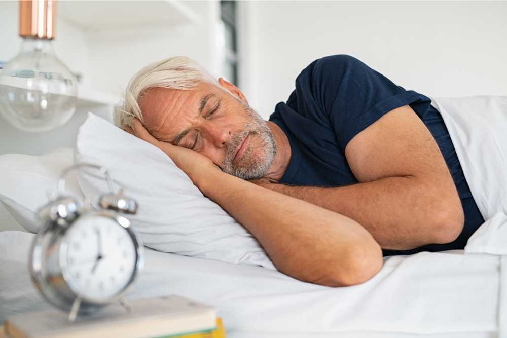 man sleeping soundly after taking delta 8 gummies