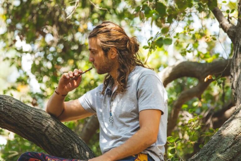 man enjoying cheef botanicals thca cart in forest