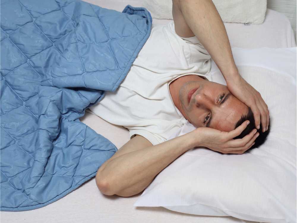 man struggling to sleep