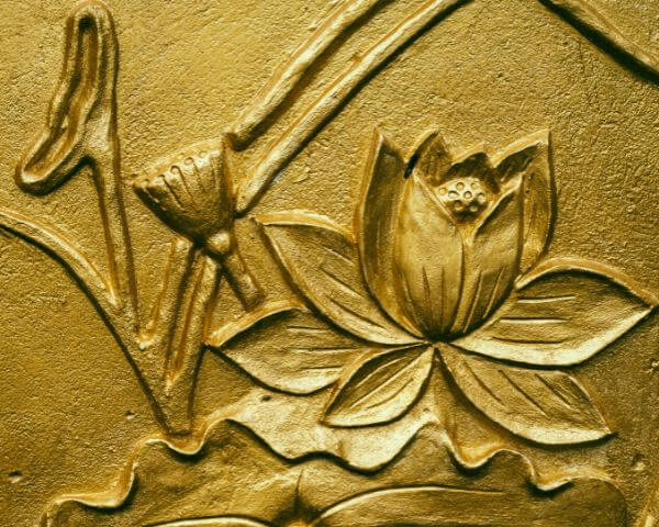 A lotus flower inscribed in gold, ancient depiction of Blue Lotus
