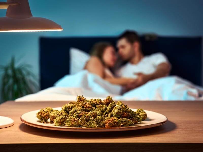 couple in bed with cannabis nearby